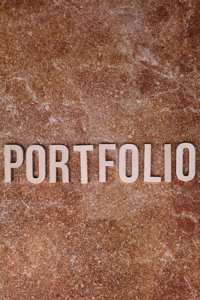 Portfolio text on a textured stone background, perfect for business themes.